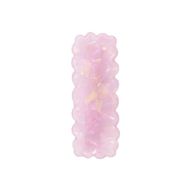A wavy rectangle iridescent hair clip in soft pink hues with a shiny, translucent finish. It features a logo.