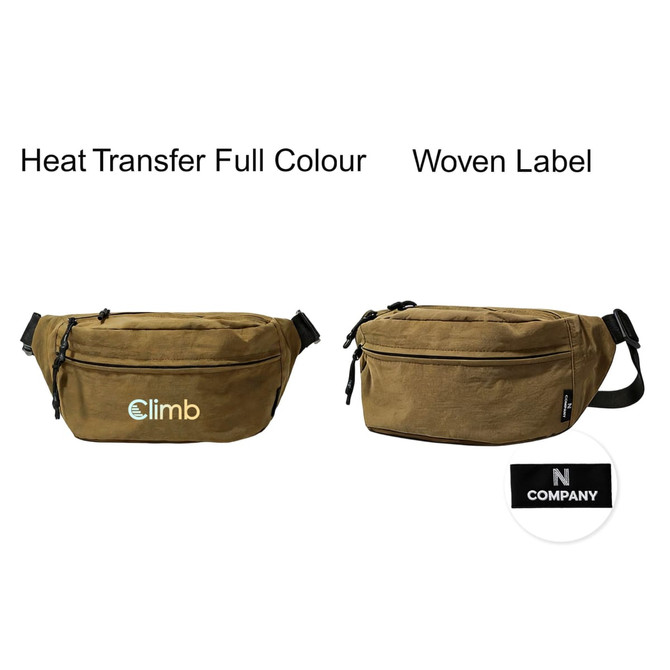 A large bum bag in khaki colour with a woven label and a logo on the front.