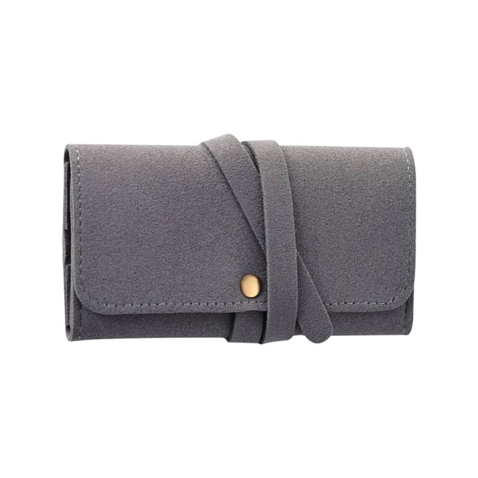 A grey synthetic leather jewellery bag with a fold-over design and a decorative strap closure.