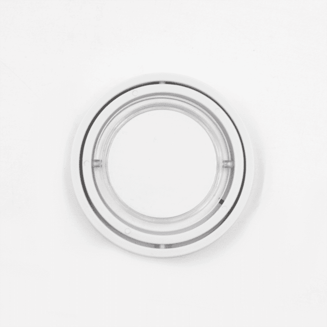 A transparent circular fidget spinner with two concentric rings. It features a smooth surface and a central spinning axis.