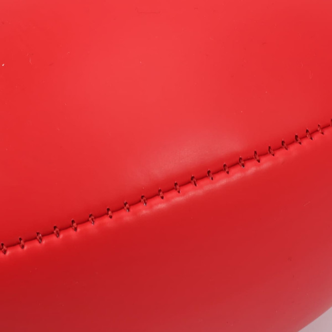 A red mini promotional Aussie Rules ball with visible stitching detail. It features a branding logo.