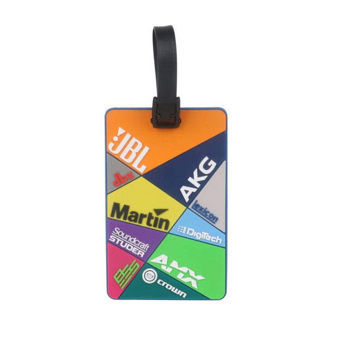 A custom-shaped PVC luggage tag in various colours with multiple logos displayed prominently.
