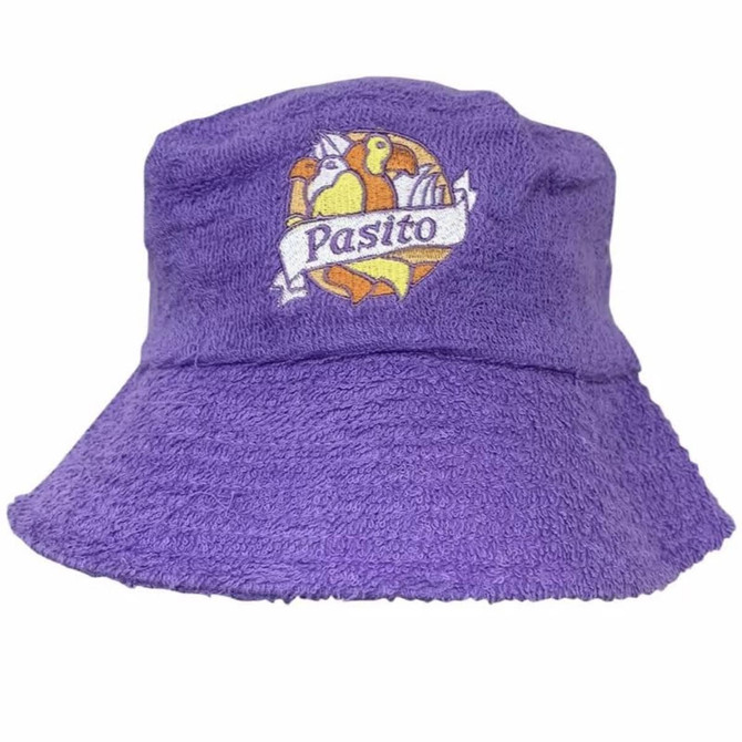 A purple terry towelling bucket hat featuring a logo on the front.