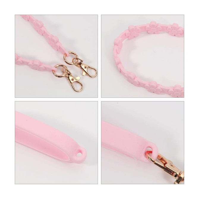A drink bottle strap featuring a pink silicone design with flower details and gold clasps for attachment.
