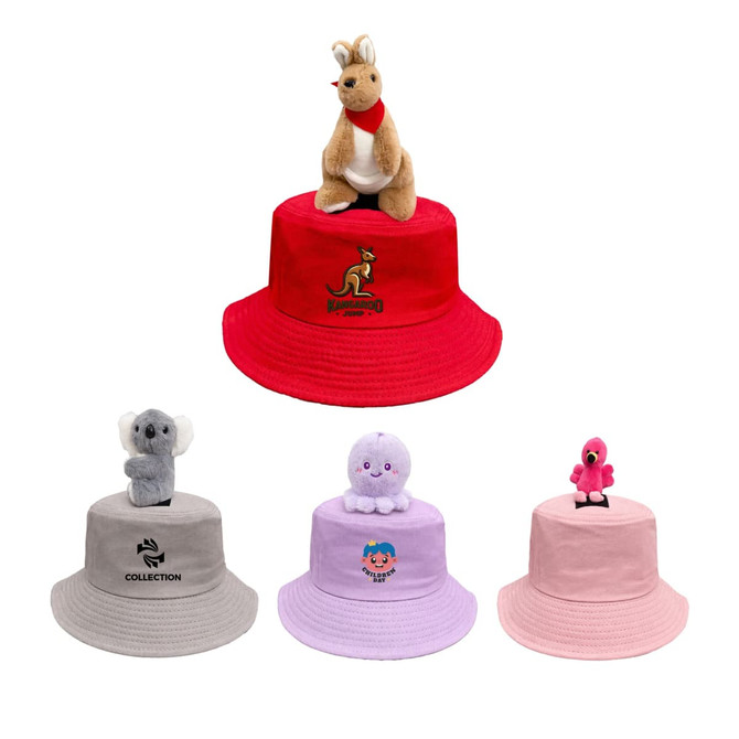 A red bucket hat featuring a kangaroo plush on top, alongside grey, pink, and beige hats with various plush characters.