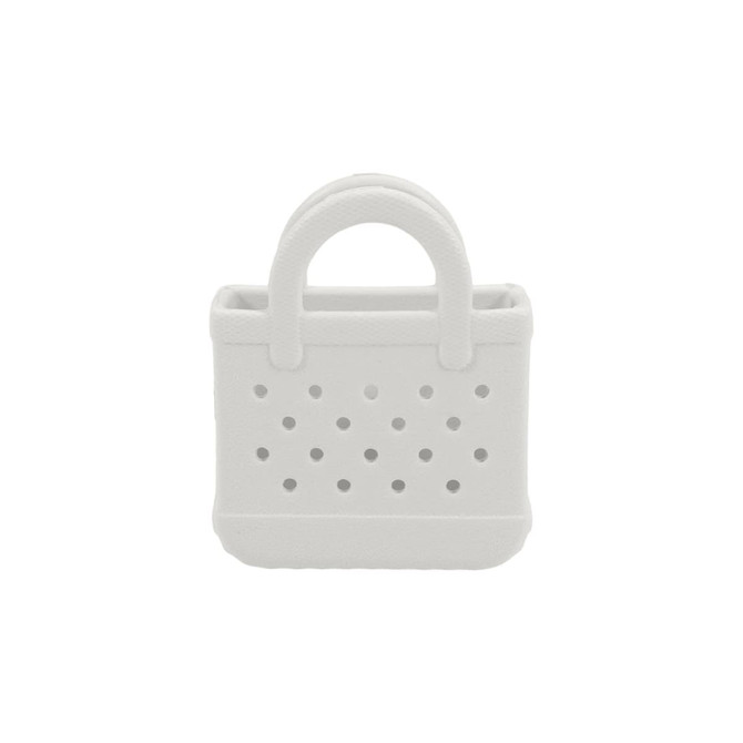 A white mini EVA bag charm with a textured finish and perforated design. It features small handles on top.