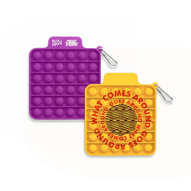 A square pop bubble board featuring a purple side with circles and a yellow side with a circular design and a logo.