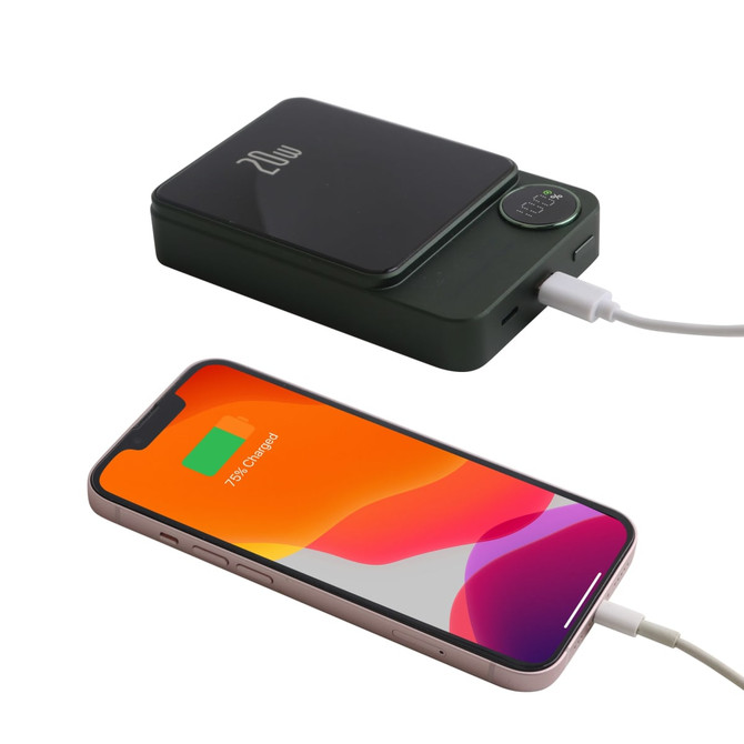 A green 10000mAh magnetic wireless power bank with a smartphone connected via cable. It features a small display and logo.