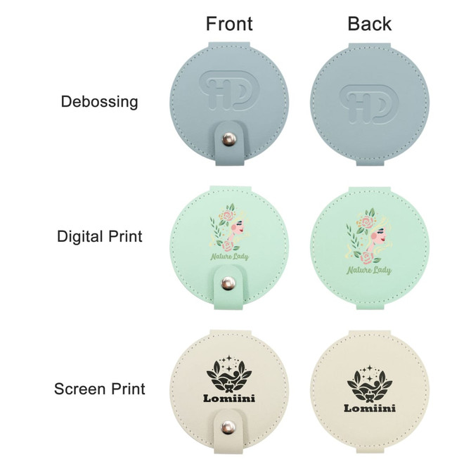 A round folding pocket mirror featuring a light blue front, a mint green back, and a cream-coloured option with various prints.