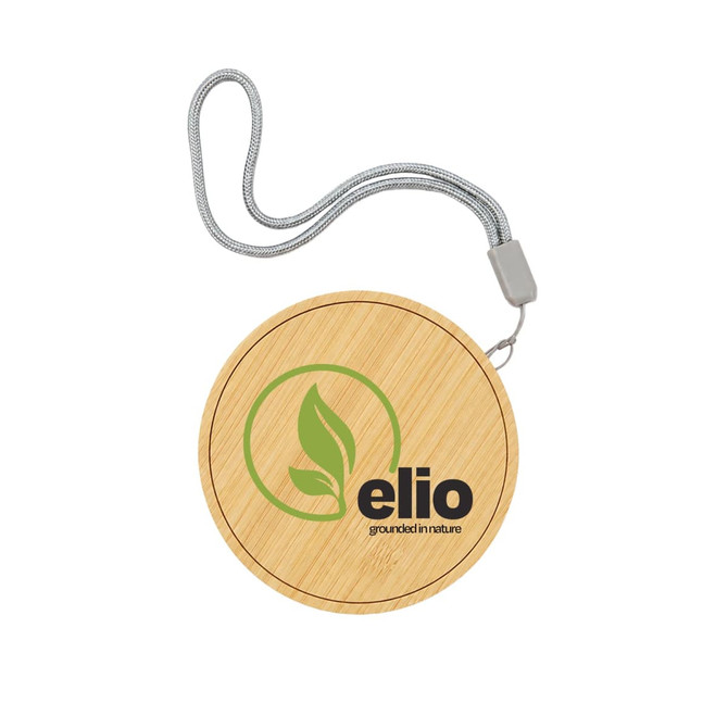 A bamboo wireless charger with a circular design and a silver strap, featuring a logo on the surface.