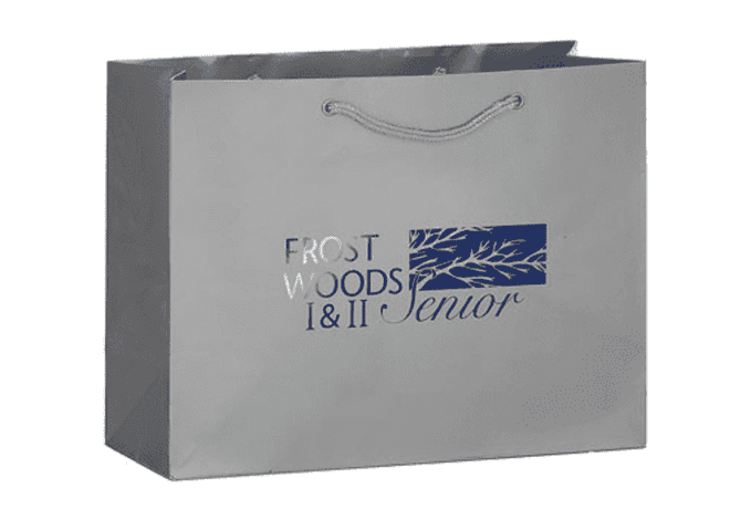 A grey tote bag with a logo and a rope handle, featuring a minimalist design and spacious interior.