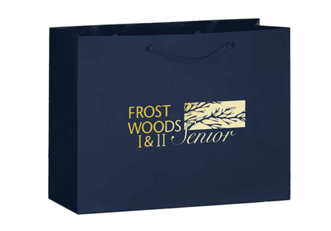 A navy tote bag with a logo featuring text and a tree design, featuring sturdy handles.