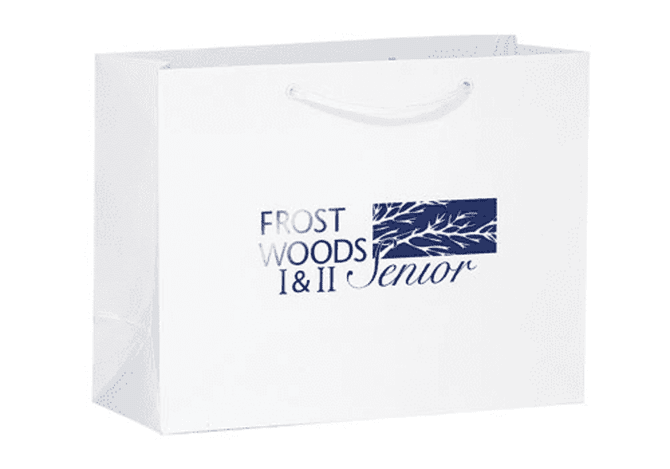 A white tote bag with a logo and text in navy blue. It features carry handles for easy transport.