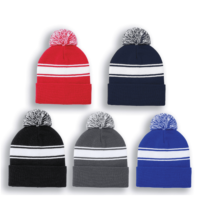 Five pom pom beanie hats in red, navy, black, grey, and blue, featuring white stripes and a decorative pom pom on top.