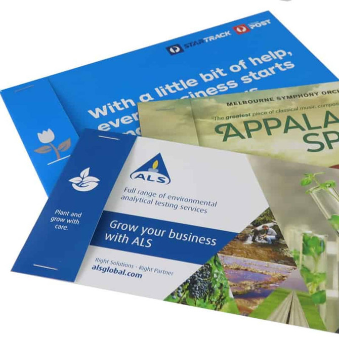 A set of promotional postcards featuring a blue design and various plant-themed graphics, with a branding logo present.