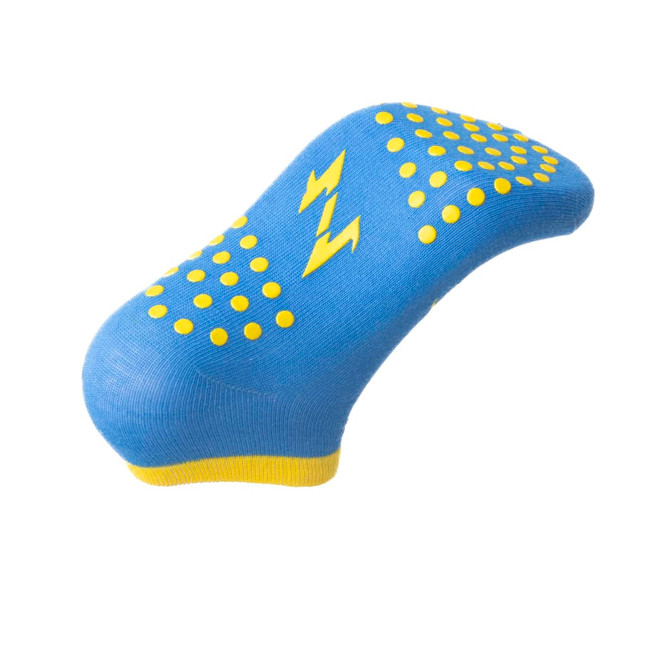 A blue sock with yellow grip dots and a lightning bolt design. It features a yellow cuff at the top.