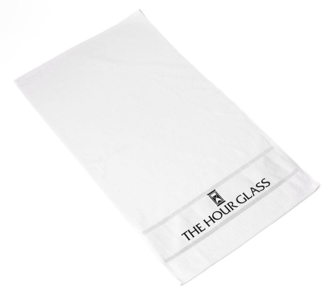 A white gym towel featuring a logo and a simple design, ideal for leisure and outdoor activities.