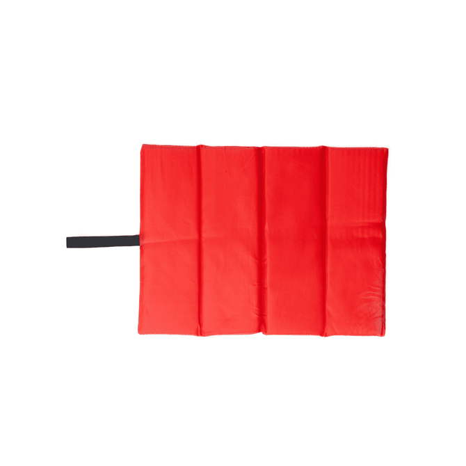 A red foldable chair cushion with four sections and a black strap, featuring a logo.