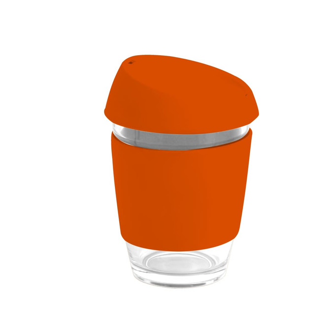 A reusable glass coffee cup with an orange silicone lid and band, featuring a transparent body and stainless steel band.