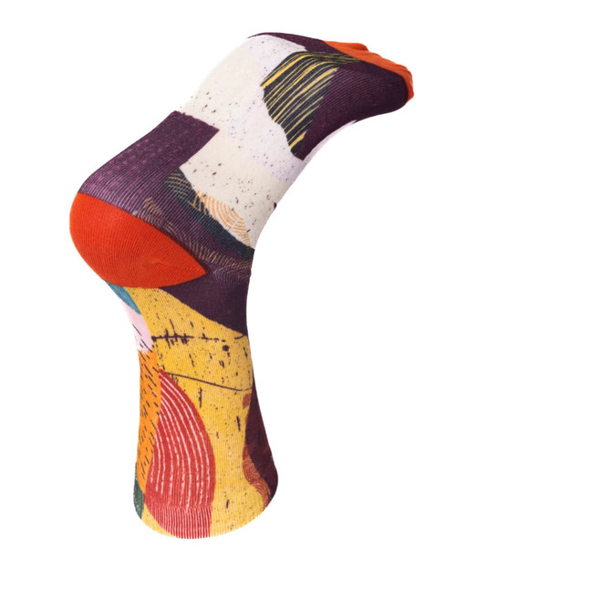 A pair of vibrant, multicoloured sublimated socks featuring abstract patterns and an orange toe. Includes a logo.