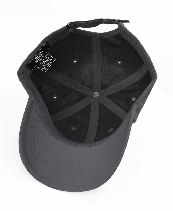 A black cap with a logo, viewed from above, showing the interior structure.