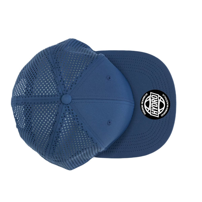 A navy blue cap with a perforated design and a round logo on the front.