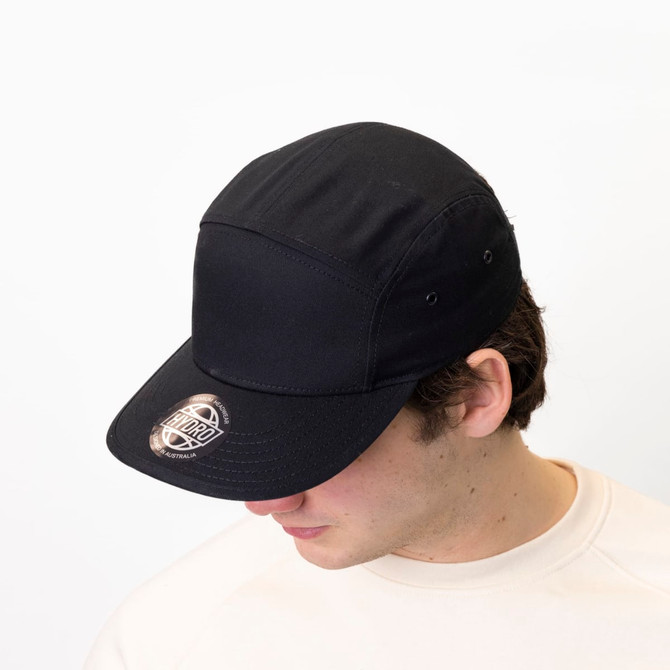 A black military style cotton twill cap with a flat peak and a logo on the front.