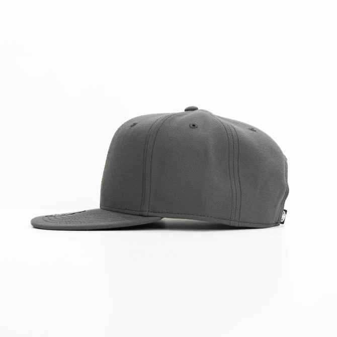 A grey cap with a flat brim, featuring a logo on the side and a textured fabric.