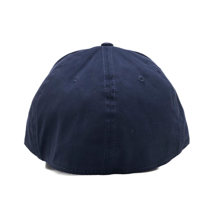 A navy cap featuring a curved brim and a decorative logo at the back.