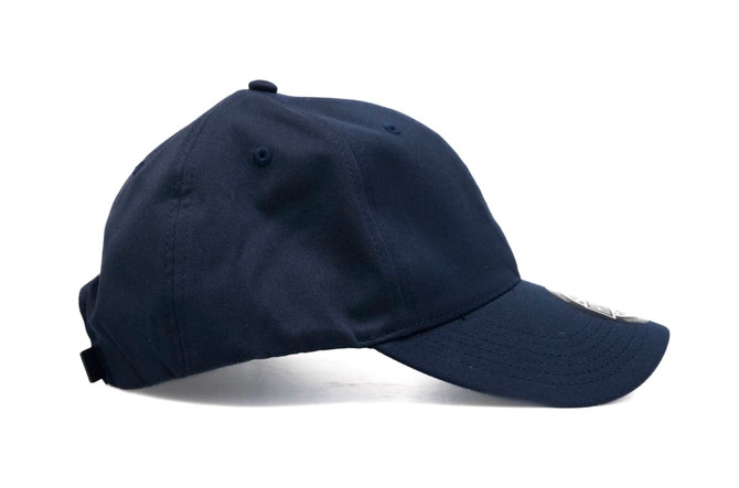A navy blue cap with a curved brim and adjustable strap, featuring a logo on the front.