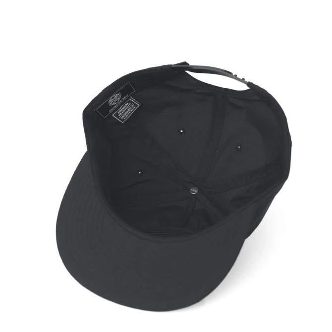 A black cap featuring a neat interior design and ventilation holes, with a branding label inside.