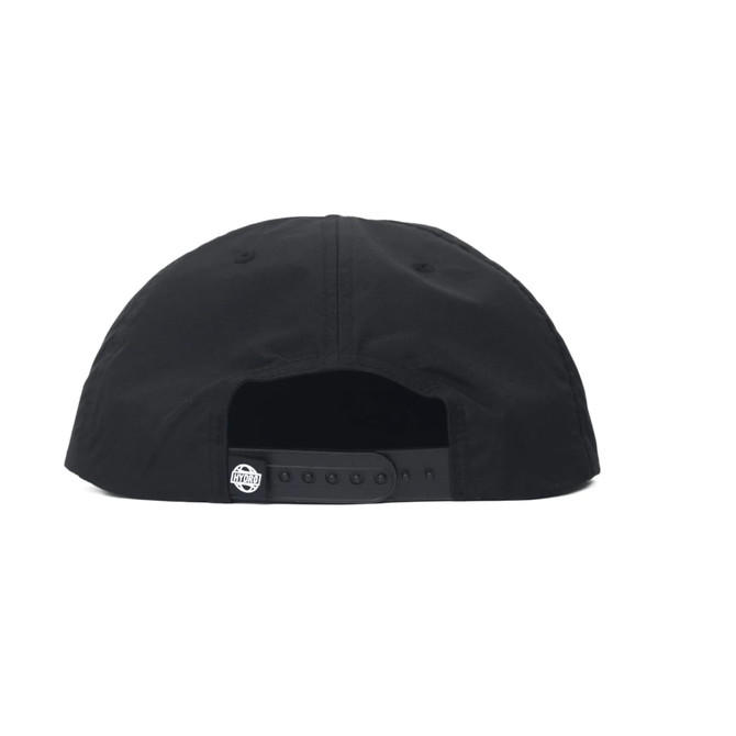 A cap in black, featuring a structured back and circular logo on the strap.