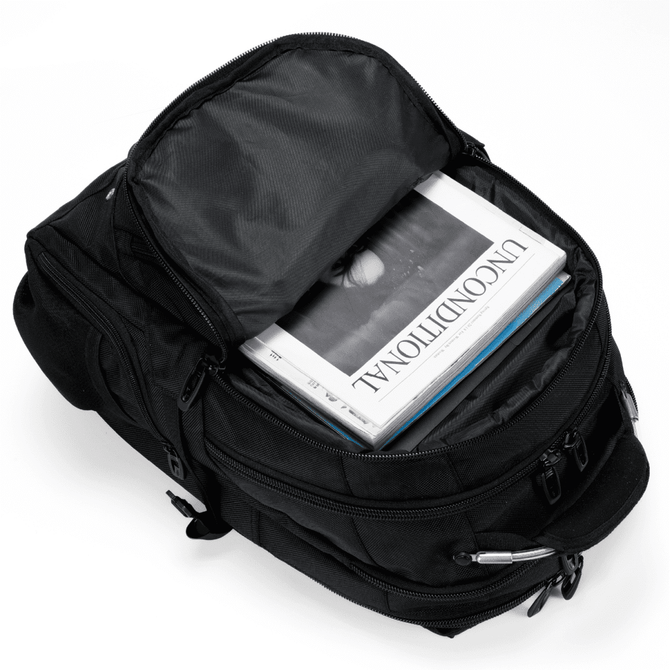 A black Eiger backpack with multiple compartments, featuring an open top revealing magazines inside.