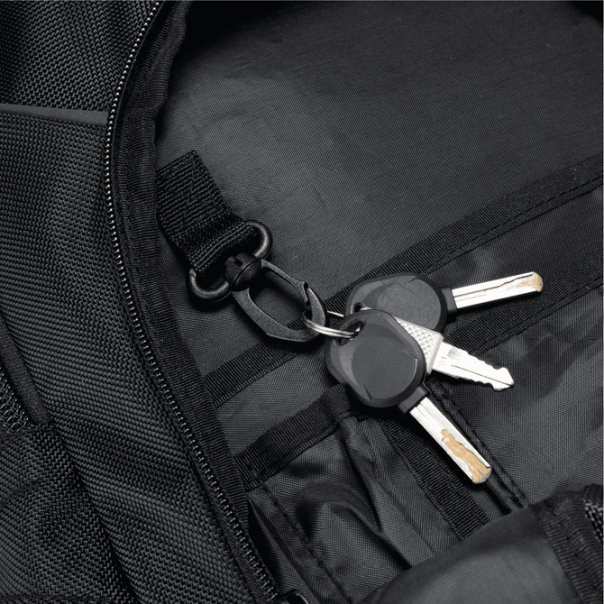 A black backpack interior featuring a hook and a set of keys attached inside.