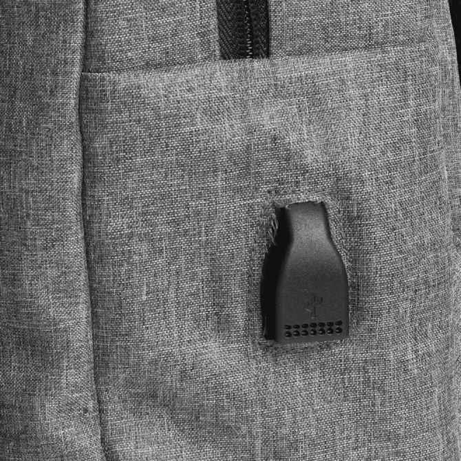 A grey backpack with zippered compartments, featuring a small branding logo on the side.