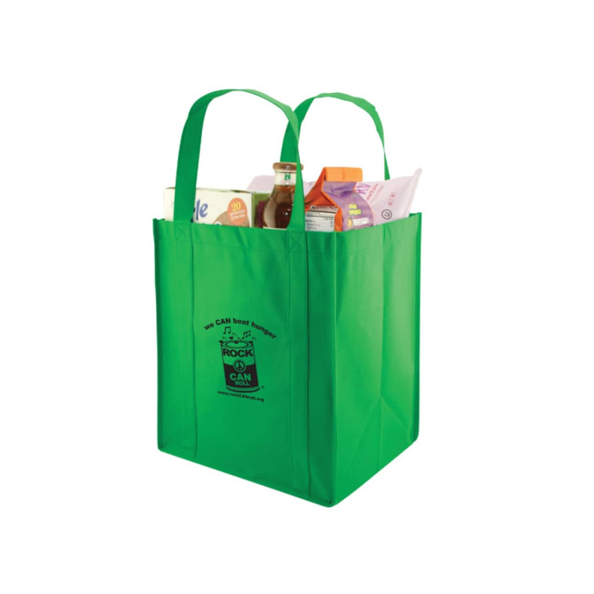 A green extra large non-woven shopping bag with two handles, filled with various grocery items and featuring a logo.