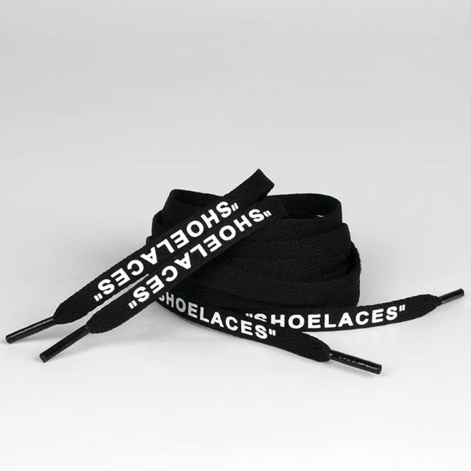 Black shoelaces with white lettering, featuring a logo, arranged in a loop on a neutral background.