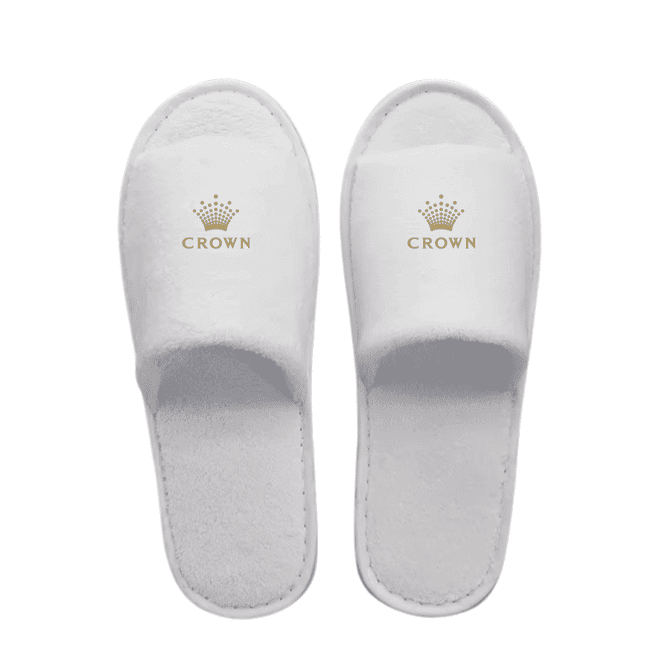 White open toe hotel slippers featuring a logo on the upper. Soft, plush material with a textured sole.