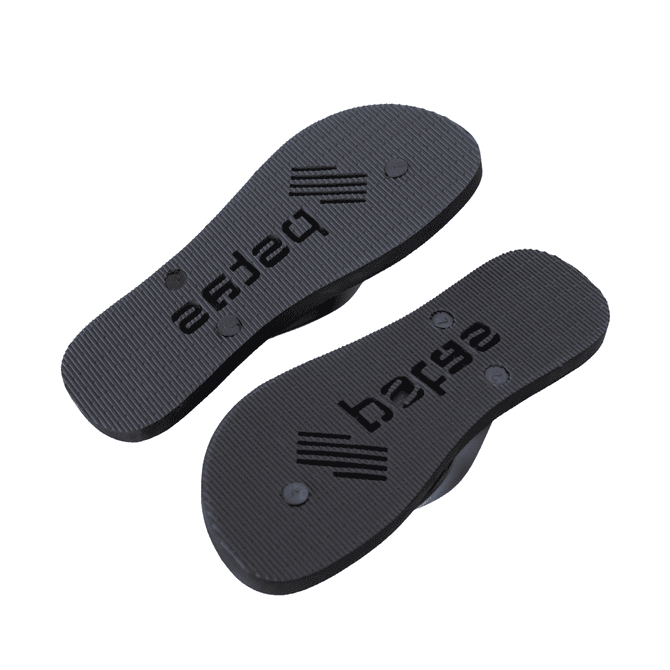 A pair of black rubber thongs with a textured sole and branding on the underside.