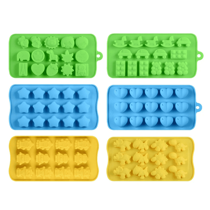 Silicone ice trays in green, blue, and yellow featuring various fun shapes like stars, cars, and hearts.