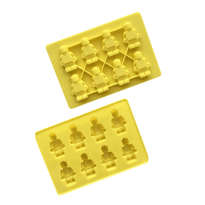 Yellow silicone ice trays featuring custom moulds shaped like miniature figures. Each tray holds multiple moulds.