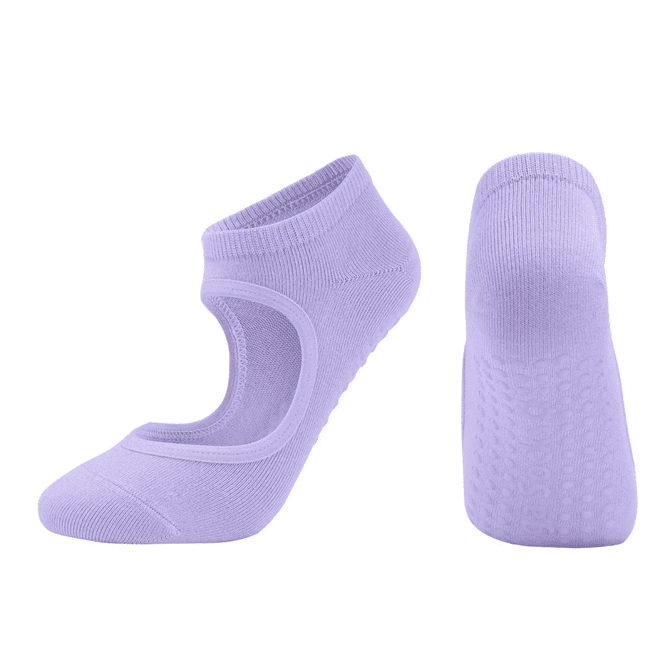 Open top yoga socks in a soft lilac colour, featuring grips on the sole and an elasticated ankle band.