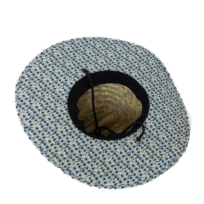 A straw hat with a patterned blue and white design and a black lining. It features a decorative inner shell pattern.