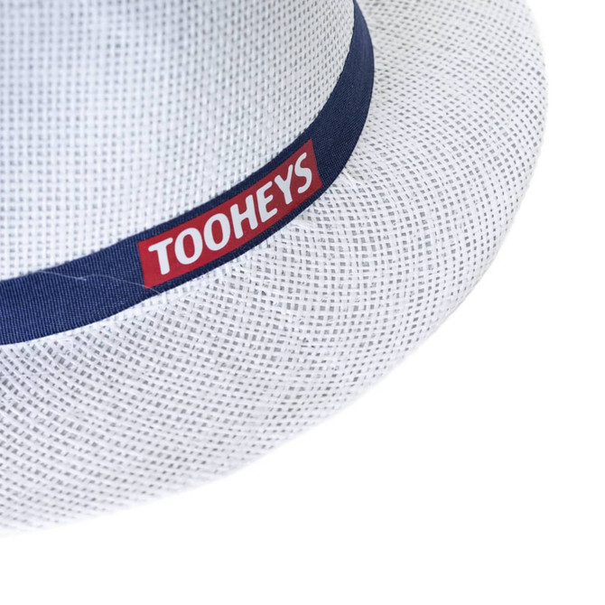 A white straw hat with a blue band featuring a logo. The hat has a textured design.