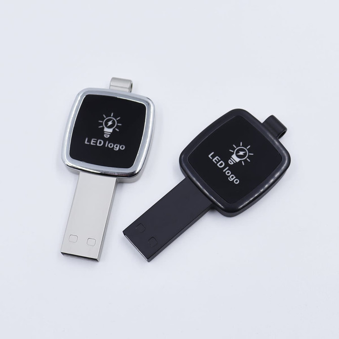 Two Apex LED USB flash drives in silver and black, featuring a logo on the front of each drive.