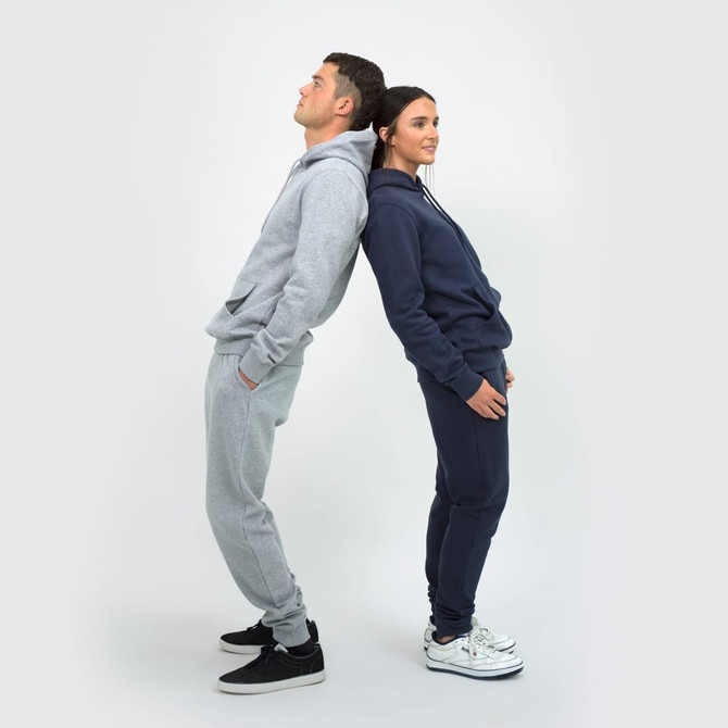 A unisex hoodie in grey and navy worn by two models, standing back to back, featuring a logo on the hood.