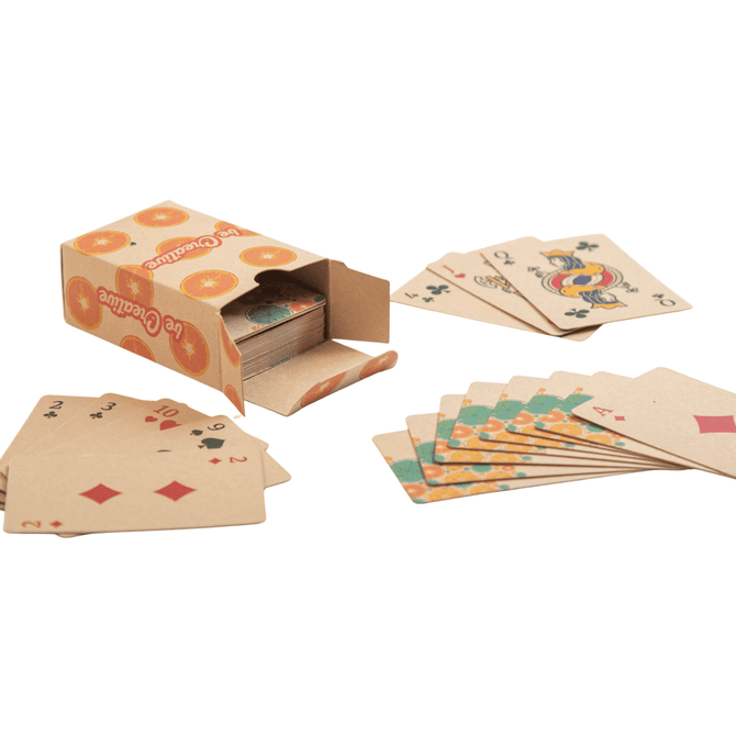 Eco-friendly custom playing cards in a cardboard box with a vibrant design, featuring various card suits and illustrations.