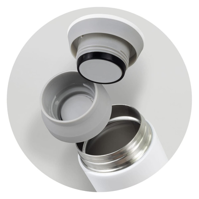 A drink bottle in white with a detachable grey lid, showcasing the interior opening and the lid's seal.