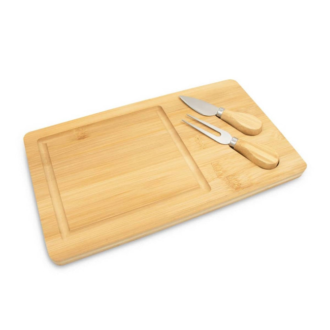 A bamboo cheese board with a carving section and two stainless steel cheese knives featuring wooden handles.