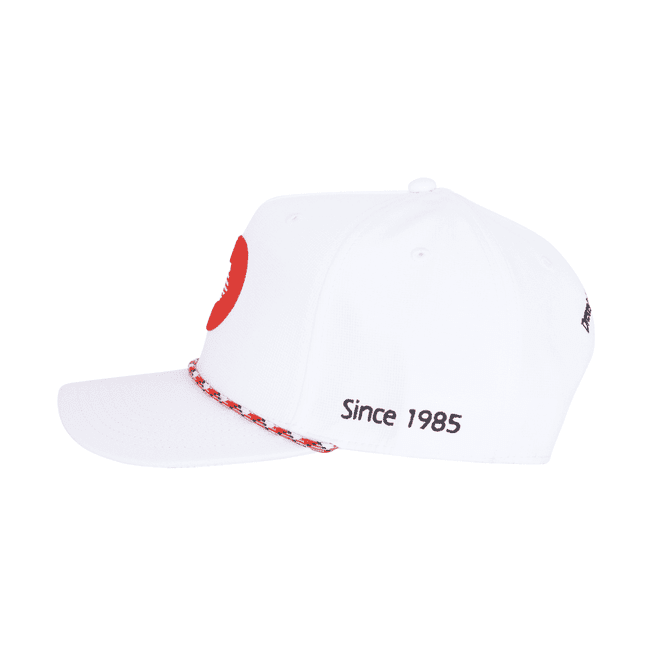 A white 5 panel polyester cap featuring a custom braid and a logo, with the text "Since 1985" on the side.